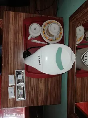 a surfboard is hanging on a shelf with plates at PANGKOR PURNAMA CHALET in Pangkor