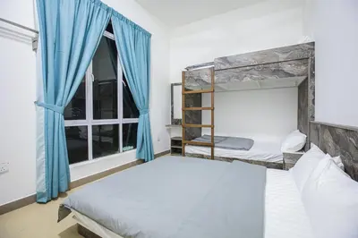 a bedroom with two bunk beds and a window at Barrington Villa @ Golden Hill in Cameron Highlands