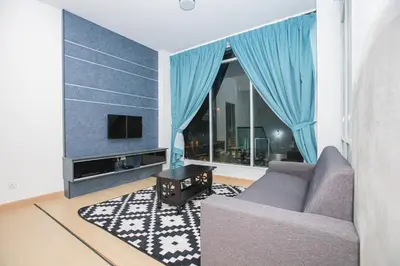 a living room with a couch and a tv at Barrington Villa @ Golden Hill in Cameron Highlands