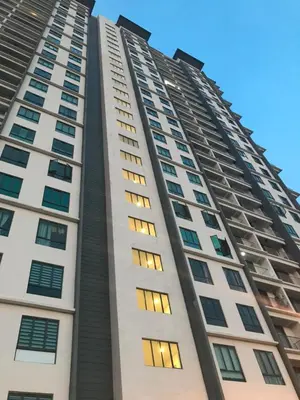 a tall white building with many windows at Haaniy Homestay Casa Kayangan Meru in Ipoh