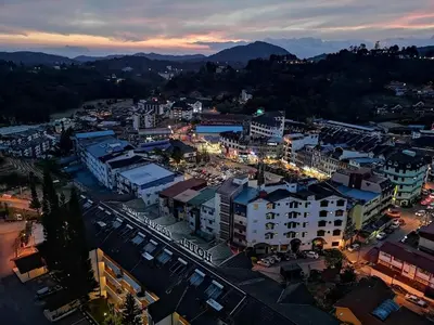 an overhead view of a city at night at Merlin Home@Crown Imperial Court in Tanah Rata
