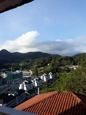 a view of a city with buildings and mountains at Merlin Home@Crown Imperial Court in Tanah Rata