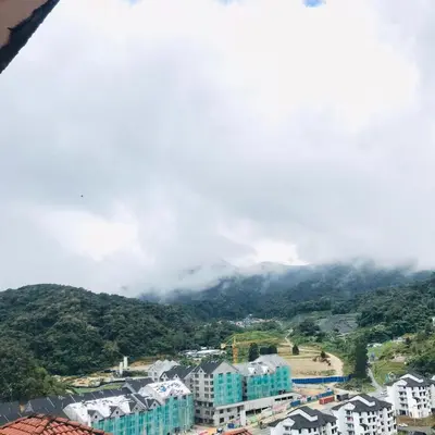 an aerial view of a city with buildings and a mountain at Merlin Home@Crown Imperial Court in Tanah Rata