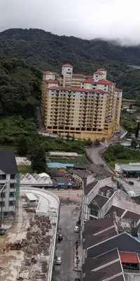 an aerial view of a city with tall buildings at Merlin Home@Crown Imperial Court in Tanah Rata