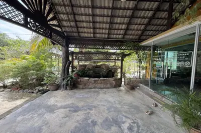 an outside view of a building with a patio at Inapan Taman Herba in Kepala Batas