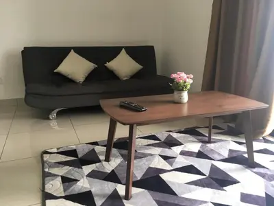 a living room with a couch and a coffee table at Miracle Woodsbury Habour Place Butterworth in Butterworth