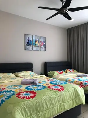 a bedroom with two beds and a ceiling fan at Miracle Woodsbury Habour Place Butterworth in Butterworth