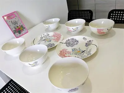 a table with four cups and bowls on it at Miracle Woodsbury Habour Place Butterworth in Butterworth