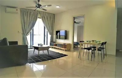 a living room with a couch and a table at Miracle Woodsbury Habour Place Butterworth in Butterworth