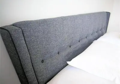 a gray headboard of a bed with a white pillow at Woodsbury homestay Studio 57 Butterworth in Butterworth