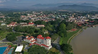 an aerial view of a large building next to a river at Hotel Casuarina@Kuala Kangsar in Kuala Kangsar
