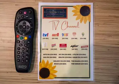 a remote control sitting next to a wii game controller at Kavy Boutique Hotel @ KBH in Brinchang