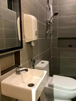 a bathroom with a sink and a toilet at Kavy Boutique Hotel @ KBH in Brinchang