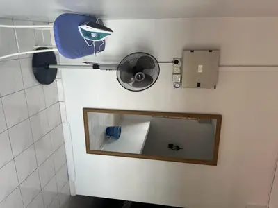 a mirror on the wall of a bathroom at 4B12B 20 pax Corner House in Ipoh