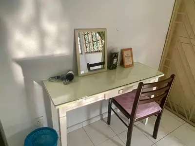 a desk with a mirror and a chair in a room at 4B12B 20 pax Corner House in Ipoh
