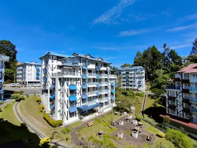 an aerial view of a building in a city at MERLIN HOME DESA ANTHURIUM in Tanah Rata