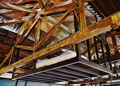 a ceiling of a building with wooden beams at Belakang KongHeng By DreamScape in Ipoh