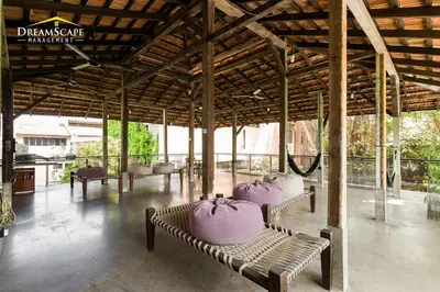 a group of benches with cakes on them in a pavilion at Belakang KongHeng By DreamScape in Ipoh