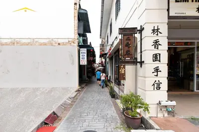 a street with writing on the side of a building at Belakang KongHeng By DreamScape in Ipoh