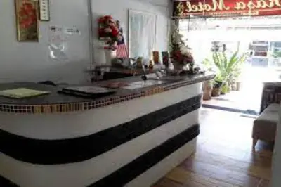 a kitchen with a black and white counter top at Hotel O Prai Jaya in Perai