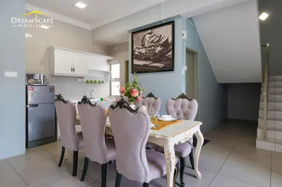 a dining room with a table and chairs at Zetter Suites by Dreamscape in Cameron Highlands