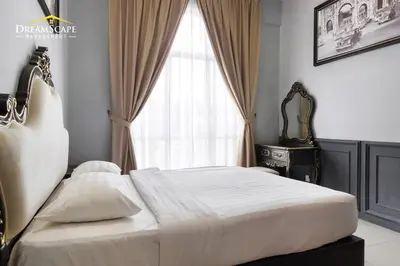 a bedroom with a large bed and a window at Zetter Suites by Dreamscape in Cameron Highlands