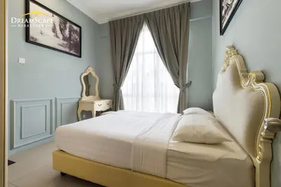 a bedroom with a large bed with a window at Zetter Suites by Dreamscape in Cameron Highlands