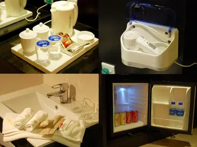 a bathroom with a sink and an open refrigerator at ERNES Hotel Bayu Mutiara in Bukit Mertajam