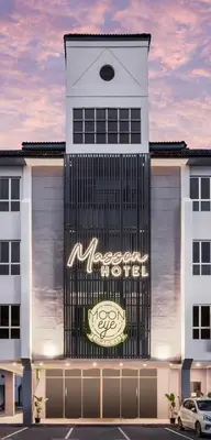 a building with a sign on the front of it at Masson Hotel Butterworth in Perai