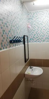 a bathroom with a sink and a mirror at Green View Home Cameron Highlands in Brinchang