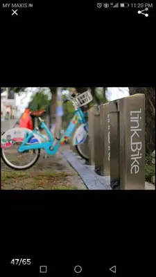 a blue bike parked on the side of a street at Tropicana 218 Georgetown #31 \u7121\u6575\u6d77\u666f \u4e00\u623f\u4e00\u5ef3\u5f0fMax.6pax in George Town