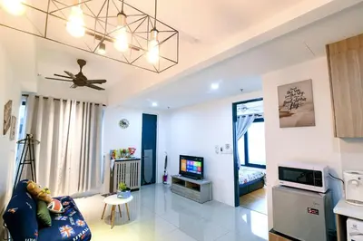 a living room with a couch and a tv at Tropicana 218 Georgetown #31 \u7121\u6575\u6d77\u666f \u4e00\u623f\u4e00\u5ef3\u5f0fMax.6pax in George Town