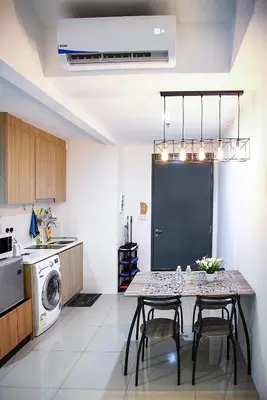 a kitchen with a table and chairs in a room at Tropicana 218 Georgetown #31 \u7121\u6575\u6d77\u666f \u4e00\u623f\u4e00\u5ef3\u5f0fMax.6pax in George Town