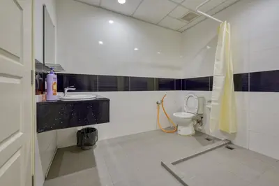 a bathroom with a toilet and a sink at Profolio @ Mansion One in George Town