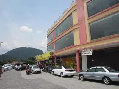 a group of cars parked in front of a building at Happy Owl in Ipoh