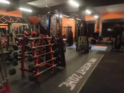 a gym with lots of equipment in a room at ANTZ Village Studio in Kampar