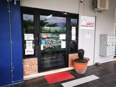 a front door of a store with a window at ANTZ Village Studio in Kampar
