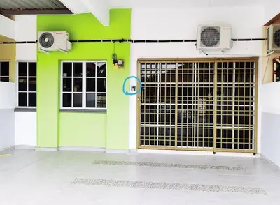 a green and white wall with a gate and a door at Bidor Totoro and One piece animation house in Kampong Kuala Gepal