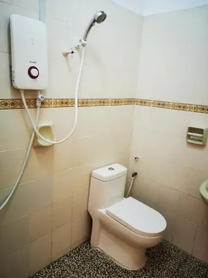 a bathroom with a toilet and a shower at Bidor Totoro and One piece animation house in Kampong Kuala Gepal