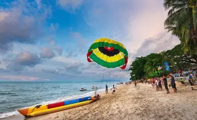 a large kite being flown on a beach at DELUXE Suite Seaview Batu Ferringhi 2304 - 2 Rooms in Batu Ferringhi
