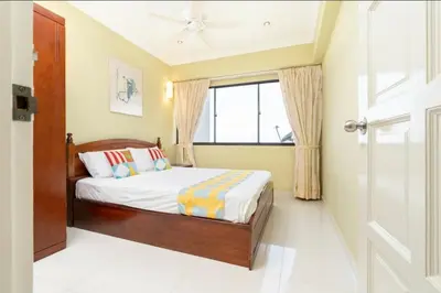 a bedroom with a bed and a window at VIP Suite Seaview Batu Ferringhi 1003-2 Bedroom in Batu Ferringhi