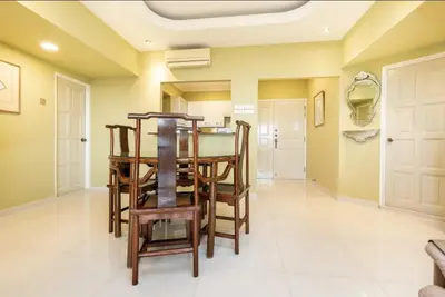 a dining room with a table and chairs at VIP Suite Seaview Batu Ferringhi 1003-2 Bedroom in Batu Ferringhi