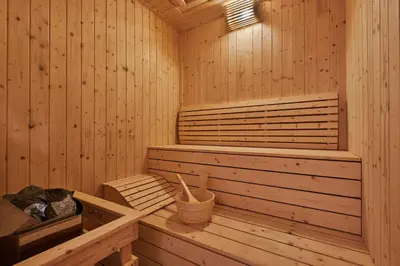 a wooden sauna with a tub and a bucket at Courtyard by Marriott Penang in George Town