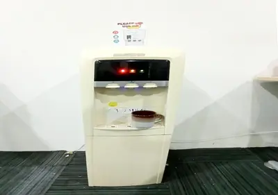 a small white refrigerator with its door open at MN Ferringhi Inn in Batu Ferringhi