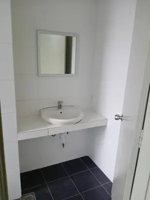 a white bathroom with a sink and a mirror at Bishops Cap at Cameron Highlands in Brinchang