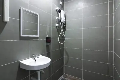 a bathroom with a sink and a mirror at URBANSTAY AT IPOH (STANDARD ROOM) in Ipoh