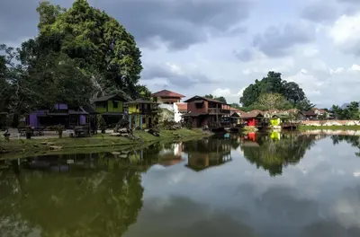 a river with houses and buildings next to a town at URBANSTAY AT IPOH (STANDARD ROOM) in Ipoh