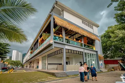 a group of people standing in front of a building at VIP Suite Seaview Resort Batu Ferringhi 1202 - 3 Rooms in Batu Ferringhi