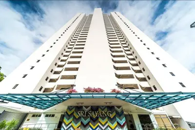 a tall white building with a sign on it at VIP Seaview Resort Batu Ferringhi 2104 - 2 Rooms in Batu Ferringhi