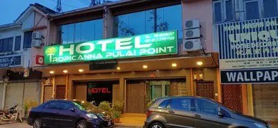 two cars parked in front of a hotel at Hotel Tropicanna Pulai Point in Ipoh